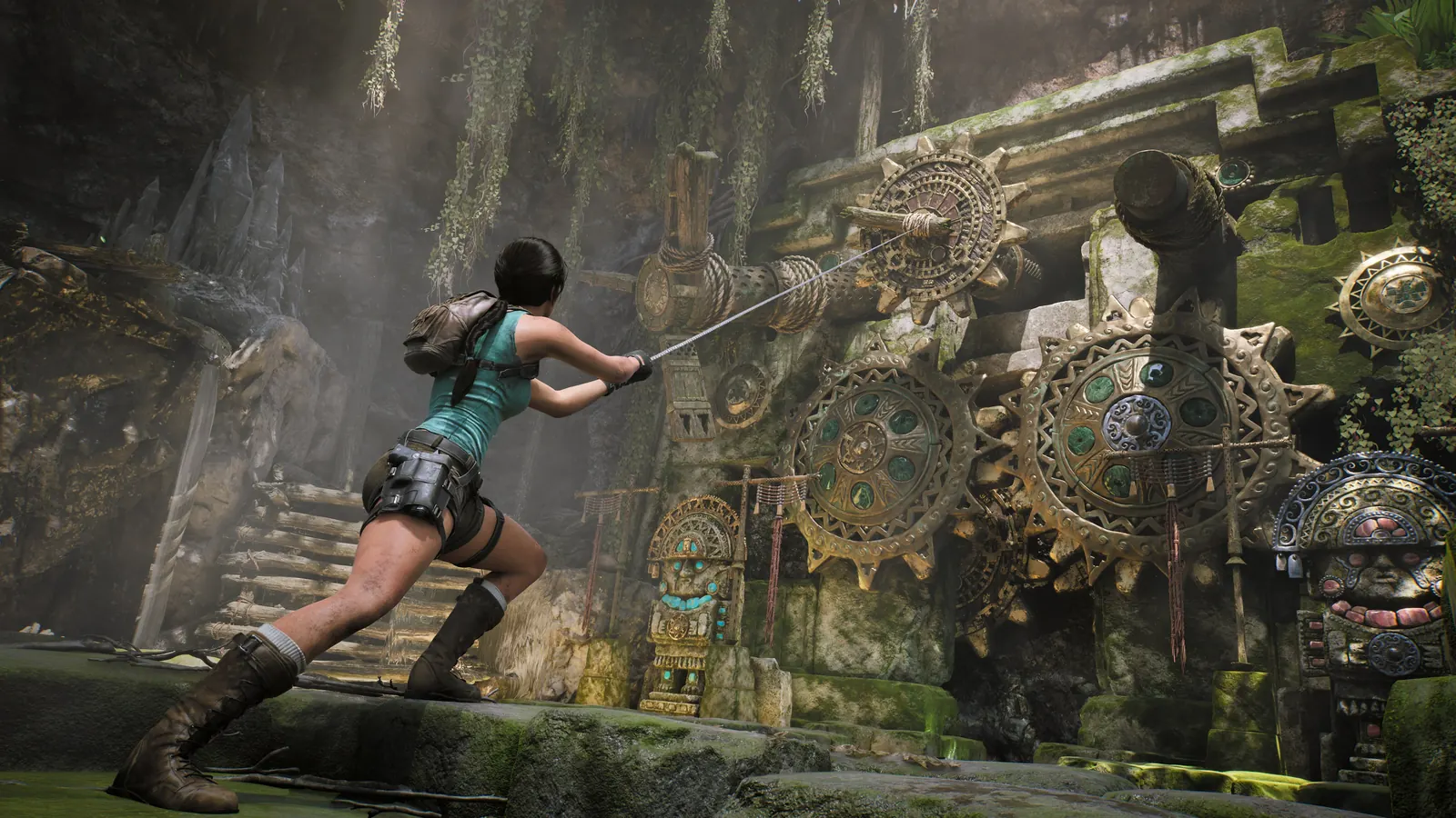 Lara using a rope on a large mechanical tomb puzzle